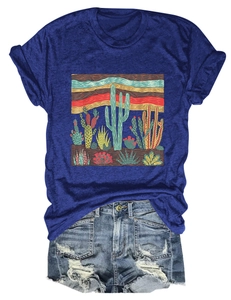 Detail of desert cactus print on navy blue T-shirt with distressed denim shorts