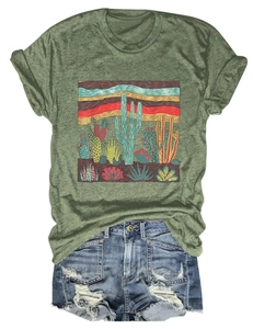 Detail of desert cactus print on a dark green crew neck T-shirt with denim shorts