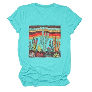 Detailed flat lay of turquoise cactus print t-shirt showing fabric texture and vibrant graphic