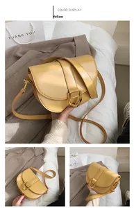 Detailansicht der gelben Satteltasche mit markanter goldener D-Schnalle und Riemen