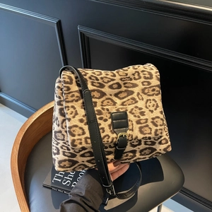 Vintage leopard print shoulder bag with black leather strap and golden buckle detail