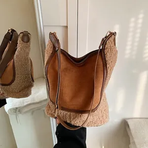 Brown suede and beige faux fur bucket bag with leather strap and gold hardware