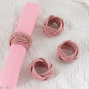 Handwoven dusty rose napkin rings set of 4 on elegant white lace tablecloth decor