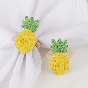 Handmade raffia pineapple napkin rings for bohemian style dining table decor