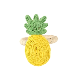 Handmade raffia napkin ring with pineapple design for bohemian tropical table settings