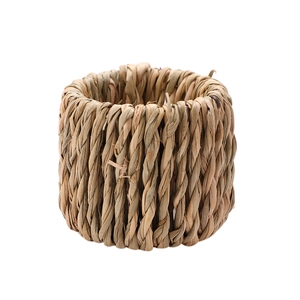 Handcrafted natural grass woven napkin ring with rustic texture for table decoration