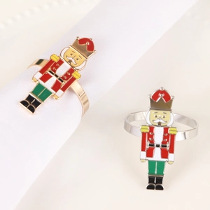 Nutcracker soldier napkin rings in colorful enamel with gold and silver finishes