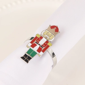 Detailed close-up of a silver nutcracker soldier napkin ring with colorful enamel inlay