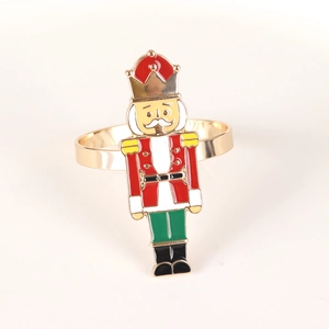 Detail of Nutcracker soldier napkin ring featuring gold plating and colorful enamel finish