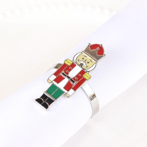 Macro detail of nutcracker soldier napkin ring with colorful enamel on silver band