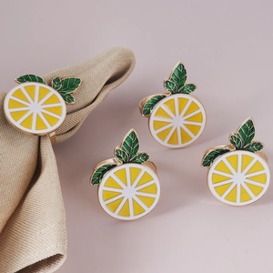 Set of 4 yellow enamel lemon napkin rings with green leaves on gold metal loops