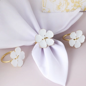 White enamel flower napkin ring with gold trim for elegant wedding table setting decor