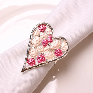 Silver heart napkin ring with pink and white textured metal inlay for table decor