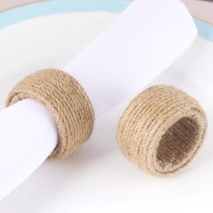 Handmade jute rope napkin rings set on white linens for elegant table settings