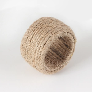 Macro shot of natural jute woven napkin ring with rustic handmade fiber texture