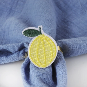 Handwoven yellow lemon embroidered napkin ring with gold metal holder for table decor