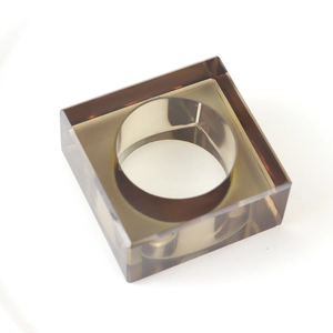 Smoky grey square resin napkin ring with geometric minimalist design on white background