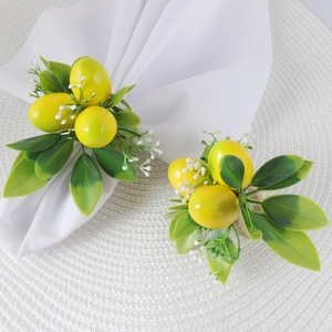 Set of two lemon napkin rings with green leaves and white flowers on woven rope base