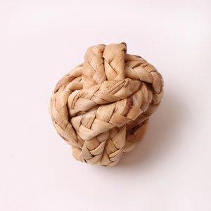 Handwoven corn husk napkin ring made of natural fiber for rustic table decoration