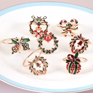 Christmas napkin ring set with reindeer wreath and bell designs for festive table decor