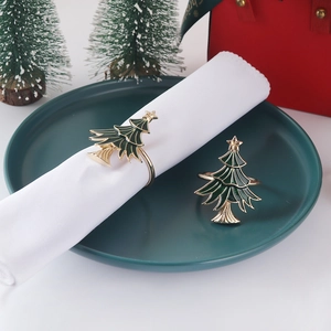 Christmas tree napkin rings in green enamel and gold finish for holiday table decor