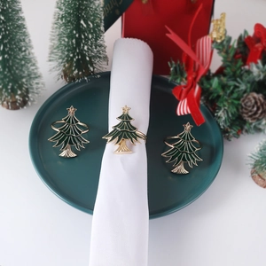Golden Christmas tree napkin rings with green enamel finish and star for table decor
