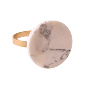 Modern gold napkin ring with round marble inlay and matte metal finish for table decor