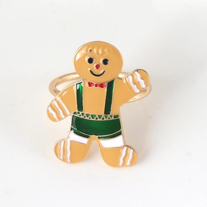 Christmas gingerbread man napkin ring with gold plating and festive enamel details
