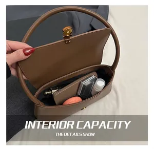 Detailed interior view of the brown hobo bag showing space for phone and makeup