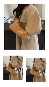Detailed view of caramel brown vintage underarm bag with soft leather and pleated texture