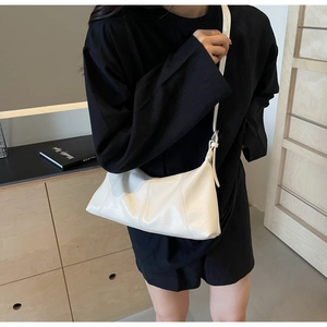 Cream vintage wax leather crossbody bag shown on model for a stylish daily outfit look