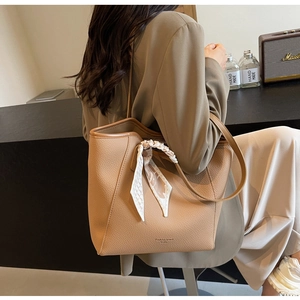 Brown litchi grain leather tote bag with silk scarf detail and large capacity for commuting