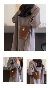 Detail of vintage brown suede bucket bag with gold magnetic clasp and long strap