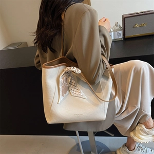 Retro cream leather bucket bag with brown strap and decorative silk scarf for women