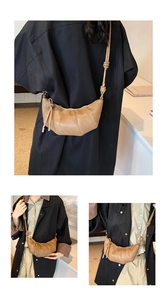 Detailed views of a tan croissant bag with signature pleated leather and knotted strap