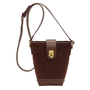 Minimalist vintage dark brown suede and leather bucket bag with golden metal clasp