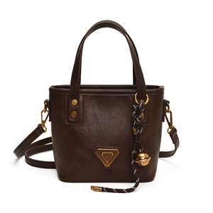 Fashionable retro brown leather bucket bag with top handles and adjustable shoulder strap