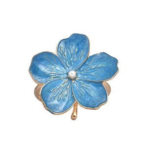 Blue enamel plum blossom napkin ring with gold petals and white pearl accent