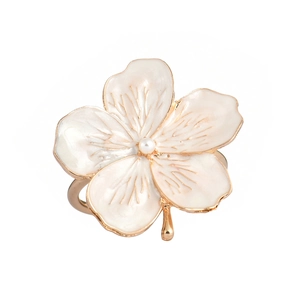 Exquisite white enamel plum blossom napkin ring with a central pearl on a gold metal band