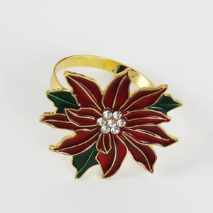 Christmas poinsettia napkin ring with red petals and rhinestones on white background