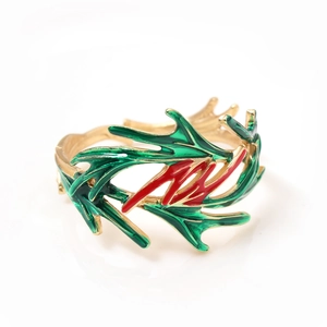 Christmas bow and tree napkin ring with festive red and green enamel and gold finish