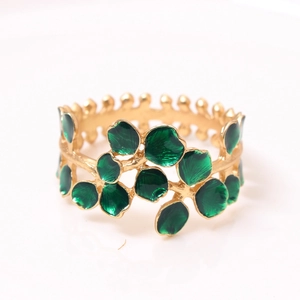 Christmas tree design napkin ring with green enamel leaves and golden vine finish