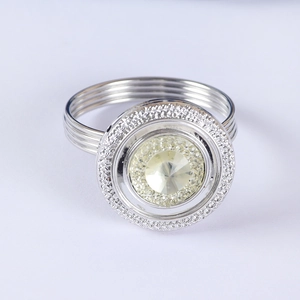 Silver napkin ring with sparkling central champagne crystal and diamond accents
