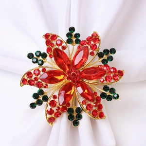 Servilletero de flor dorada con diamantes rojos para decoración elegante de bodas