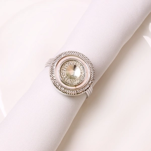 Silver napkin ring with sparkling crystal accents and central stone for wedding decor