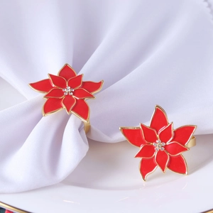 Elegant red poinsettia flower napkin rings with gold trim and rhinestones for table decor
