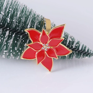Elegant red flower napkin ring with gold edges and crystals on white background