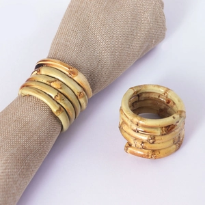 Handcrafted bamboo knot napkin rings with a natural spiral design for elegant table settings