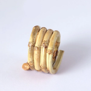 Handcrafted bamboo napkin ring with natural wood texture and spiral design for dining decor