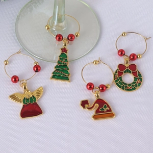 Set of 4 Christmas wine glass charms with festive zinc alloy designs for holiday stemware
